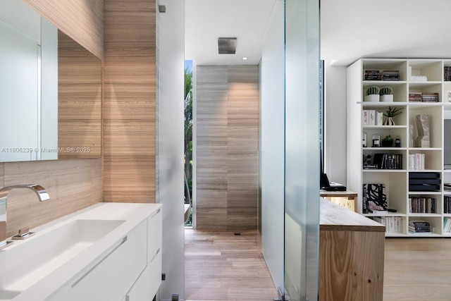 4700 N Meridian Ave, Miami Beach, FL 33140 - full bathroom with tasteful backsplash, vanity, wood finished floors, and a shower