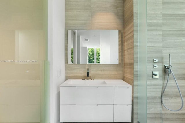 4700 N Meridian Ave, Miami Beach, FL 33140 - full bath featuring tile walls, vanity, and tiled shower