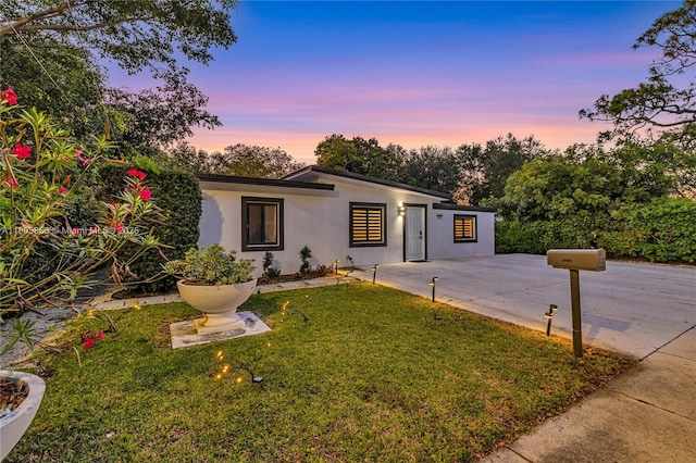 13550 NW 5th Ave, North Miami, FL 33168 - mid-century modern home featuring a lawn and stucco siding