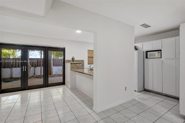 6703 Kingsmoor Way, Miami Lakes, FL 33014 - unfurnished room featuring light tile patterned flooring, french doors, and recessed lighting