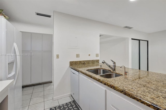 6703 Kingsmoor Way, Miami Lakes, FL 33014 - kitchen featuring a sink, white appliances, light stone countertops, light tile patterned floors, and baseboards