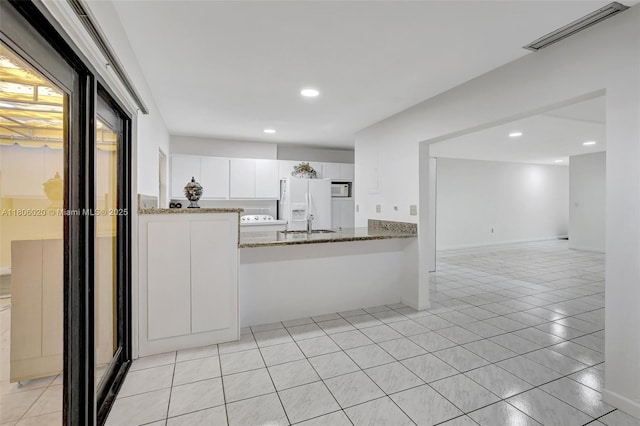 6703 Kingsmoor Way, Miami Lakes, FL 33014 - kitchen featuring white appliances, light stone counters, white cabinets, recessed lighting, and light tile patterned flooring