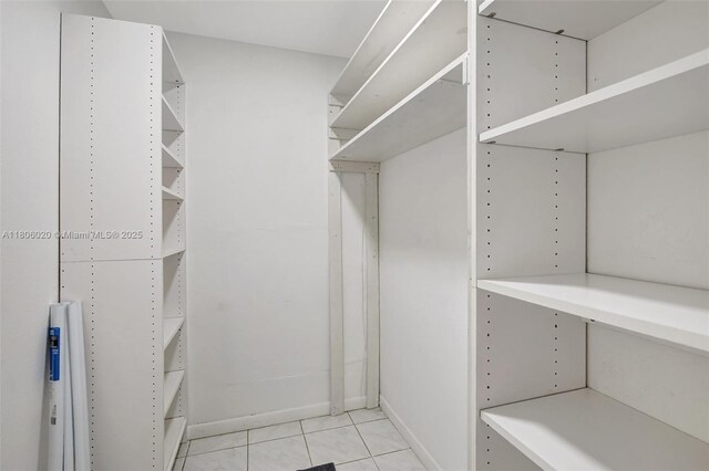 6703 Kingsmoor Way, Miami Lakes, FL 33014 - walk in closet featuring light tile patterned floors
