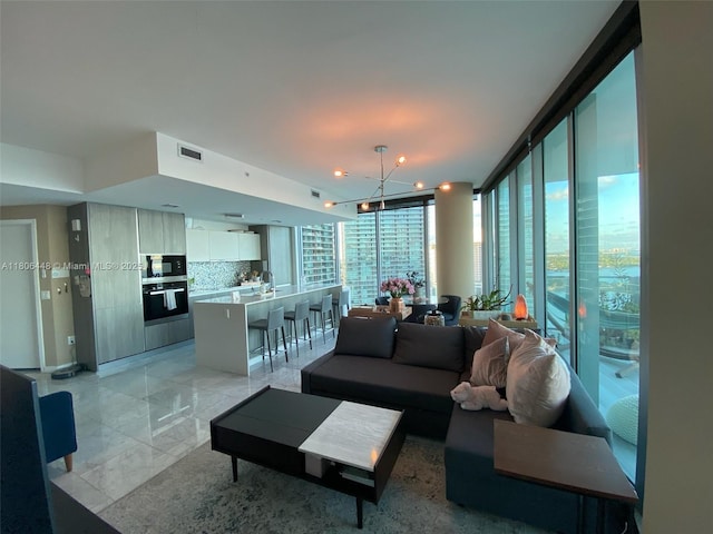 2900 NE 7th Ave Unit 2102, Miami, FL 33137 - living room with a chandelier