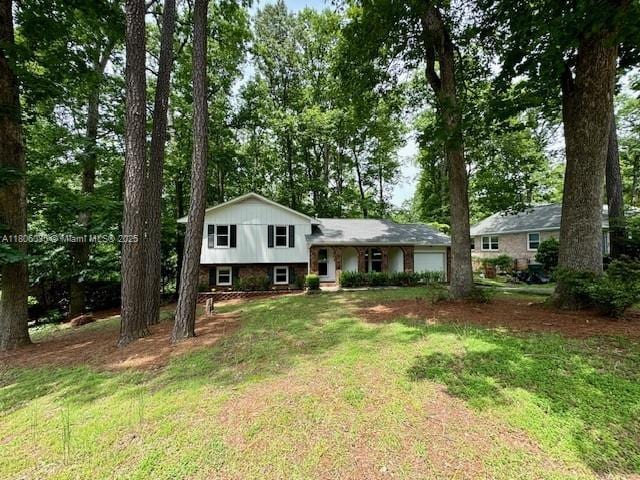 902 Vickie Dr, ,, NC 27511 - tri-level home featuring a garage and a front lawn