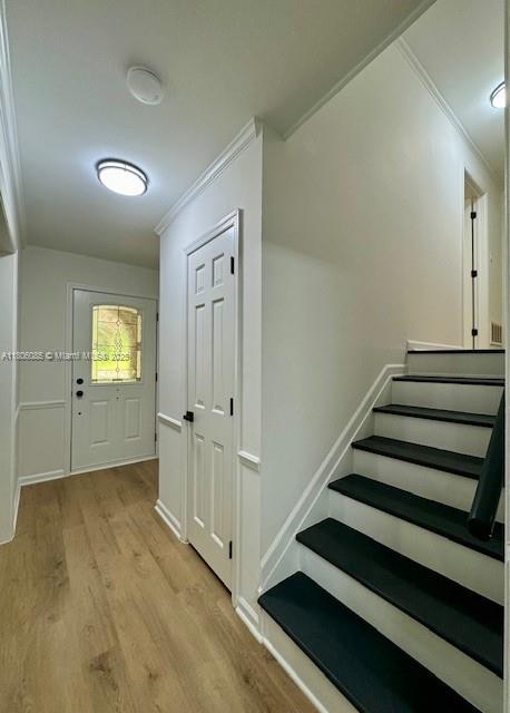 902 Vickie Dr, ,, NC 27511 - stairs featuring ornamental molding and wood finished floors