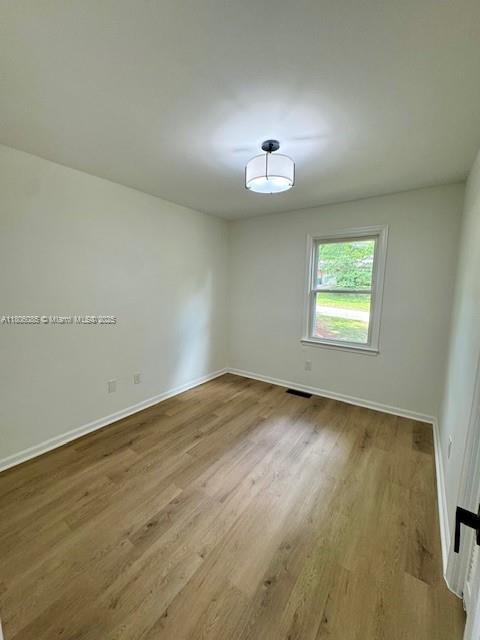 902 Vickie Dr, ,, NC 27511 - unfurnished room with wood finished floors