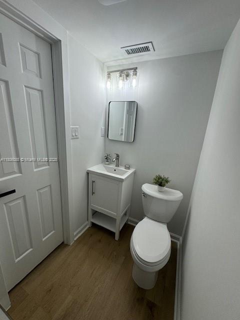 902 Vickie Dr, ,, NC 27511 - bathroom featuring wood finished floors and vanity