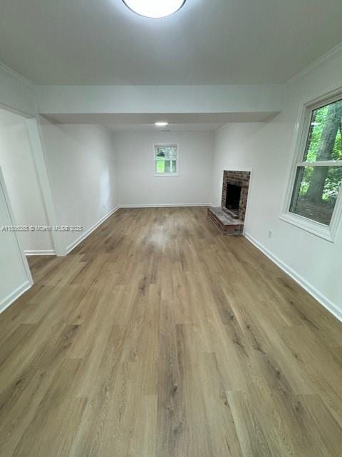 902 Vickie Dr, ,, NC 27511 - unfurnished living room featuring wood finished floors and a brick fireplace