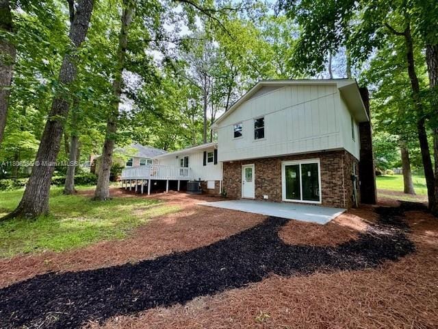 902 Vickie Dr, ,, NC 27511 - back of property featuring a patio, a deck, and board and batten siding