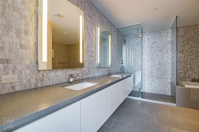 88 SW 7th St Unit 2504, Miami, FL 33130 - full bath with tile walls, a shower stall, tile patterned floors, double vanity, and tasteful backsplash