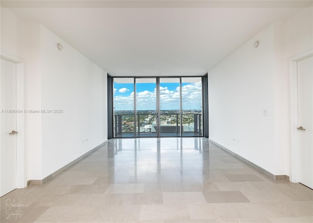 88 SW 7th St Unit 2504, Miami, FL 33130 - unfurnished room with floor to ceiling windows and baseboards