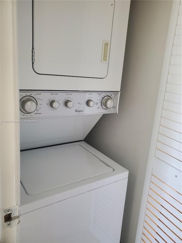 1775 Washington Ave Unit 4A, Miami Beach, FL 33139 - washroom featuring stacked washer and clothes dryer