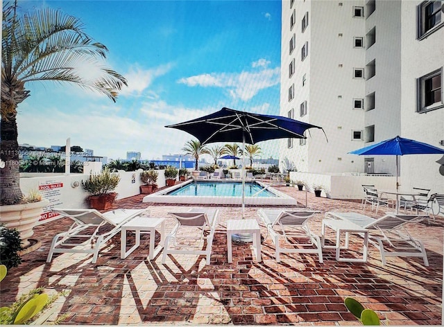 1775 Washington Ave Unit 4A, Miami Beach, FL 33139 - community pool with a patio area