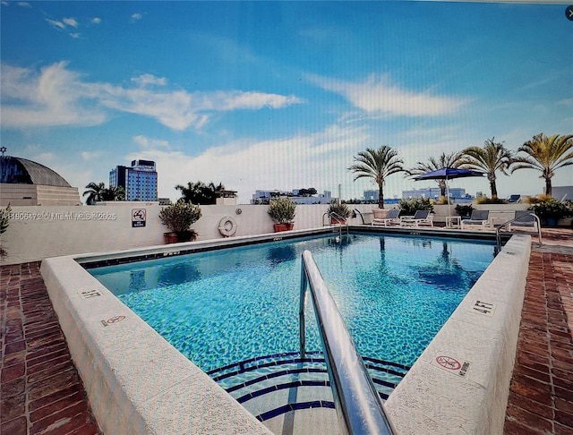 1775 Washington Ave Unit 4A, Miami Beach, FL 33139 - community pool with a patio area
