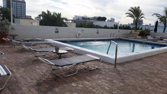 1775 Washington Ave Unit 4A, Miami Beach, FL 33139 - community pool with a view of city and a patio area