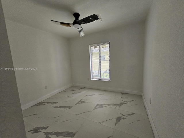 714 NW 4th Ave, Pompano Beach, FL 33060 - unfurnished room featuring light marble finish flooring, baseboards, and ceiling fan