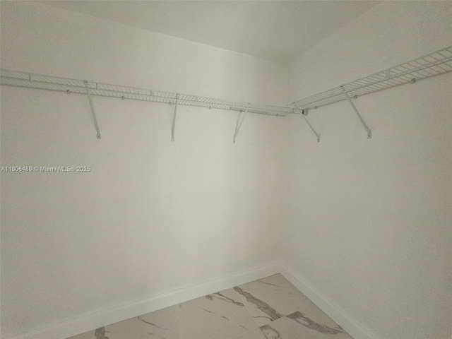 714 NW 4th Ave, Pompano Beach, FL 33060 - spacious closet featuring light marble finish flooring