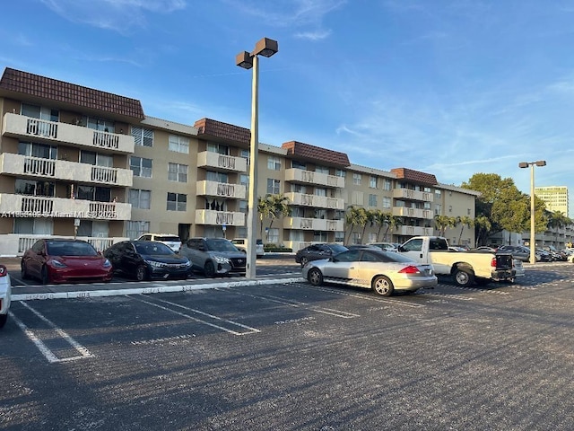 1800 Sans Souci Blvd Unit 115, North Miami, FL 33181 - view of apartment building / complex with uncovered parking