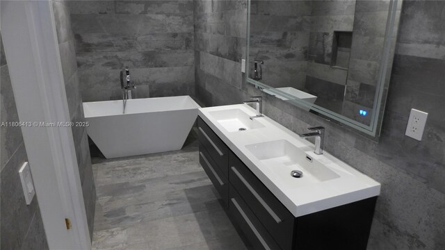 14430 SW 108th St, Miami, FL 33186 - full bathroom with tile walls, a soaking tub, and double vanity