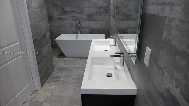 14430 SW 108th St, Miami, FL 33186 - full bathroom with tile walls, double vanity, and a freestanding bath
