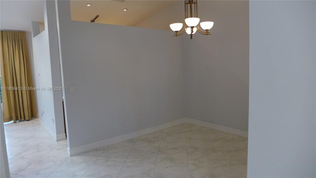 14430 SW 108th St, Miami, FL 33186 - empty room featuring light marble finish floors, a chandelier, and baseboards