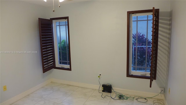 14430 SW 108th St, Miami, FL 33186 - empty room featuring baseboards and light marble finish floors