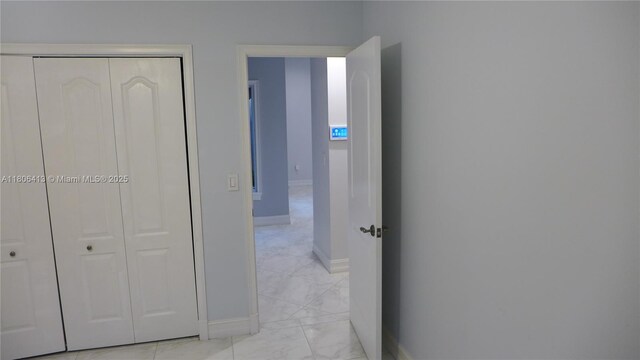 14430 SW 108th St, Miami, FL 33186 - hallway featuring baseboards and light marble finish flooring