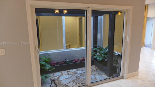 14430 SW 108th St, Miami, FL 33186 - doorway with baseboards and tile patterned flooring