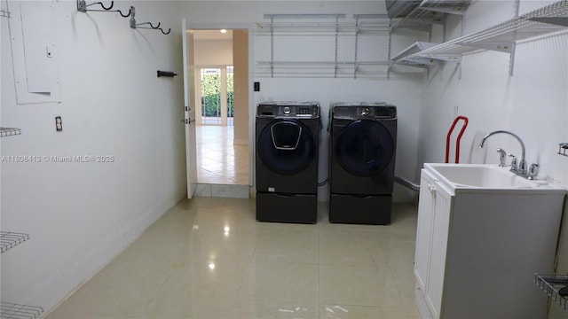 14430 SW 108th St, Miami, FL 33186 - laundry area with washer and dryer, light tile patterned flooring, and cabinet space