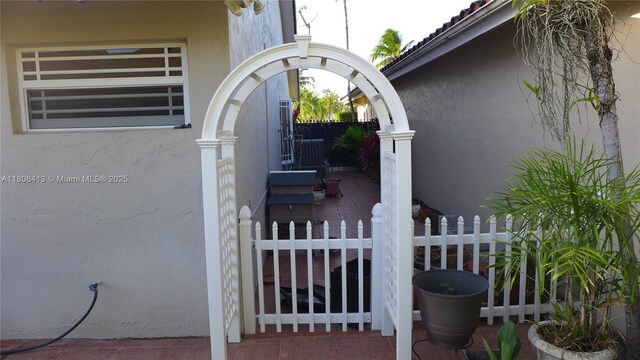 14430 SW 108th St, Miami, FL 33186 - exterior view of stucco siding and a gate