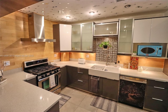 101 NE 9th Ave, Hialeah, FL 33010 - kitchen with stainless steel range with gas cooktop, dishwasher, wall chimney exhaust hood, and modern cabinets