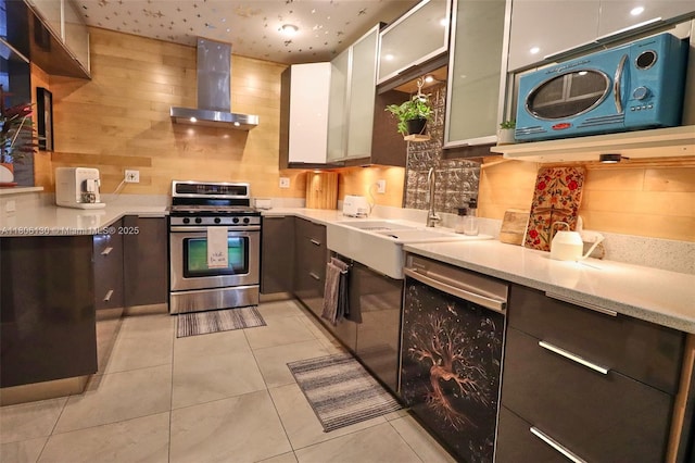 101 NE 9th Ave, Hialeah, FL 33010 - kitchen featuring gas stove, exhaust hood, modern cabinets, tasteful backsplash, and light countertops