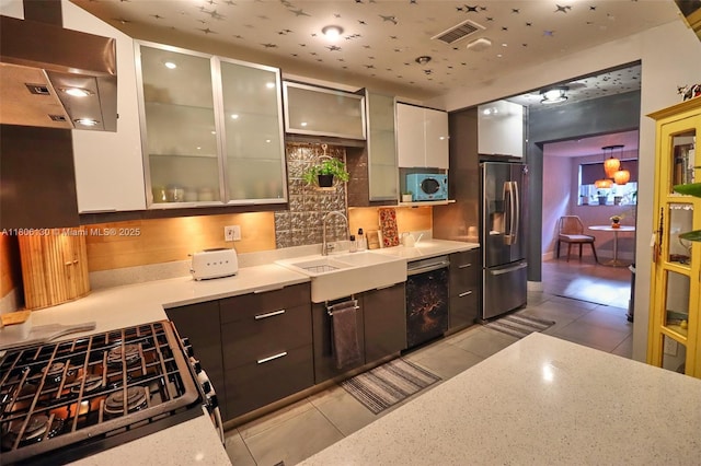 101 NE 9th Ave, Hialeah, FL 33010 - kitchen with stainless steel refrigerator with ice dispenser, dishwasher, a sink, gas range oven, and light tile patterned floors