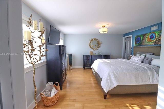 101 NE 9th Ave, Hialeah, FL 33010 - bedroom featuring light wood-style floors and baseboards