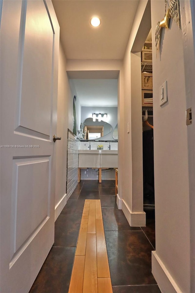 101 NE 9th Ave, Hialeah, FL 33010 - bathroom featuring recessed lighting, baseboards, and concrete floors