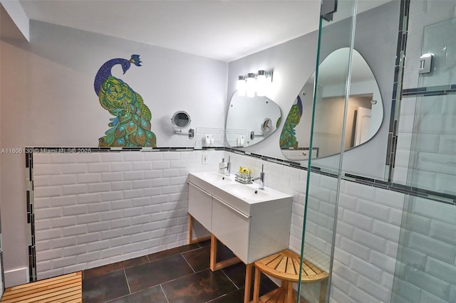 101 NE 9th Ave, Hialeah, FL 33010 - full bath with tile walls, tile patterned flooring, a shower stall, double vanity, and a wainscoted wall