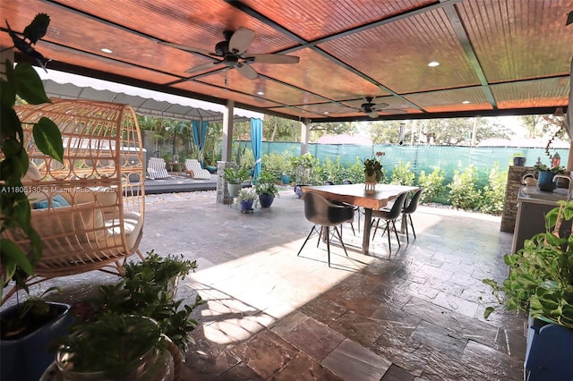 101 NE 9th Ave, Hialeah, FL 33010 - fenced backyard featuring outdoor dining area, ceiling fan, a gazebo, and a patio
