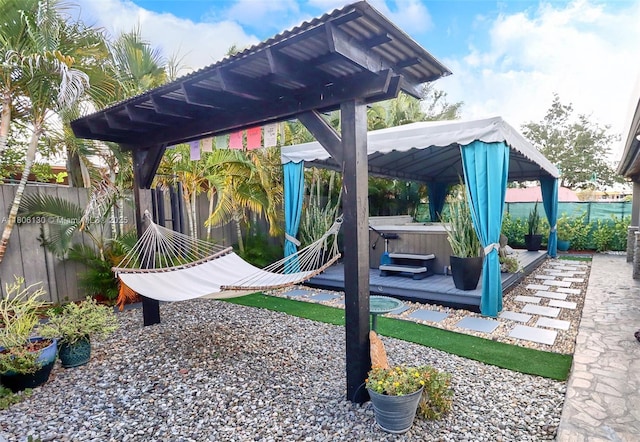 101 NE 9th Ave, Hialeah, FL 33010 - fenced backyard featuring a hot tub, a gazebo, and a deck