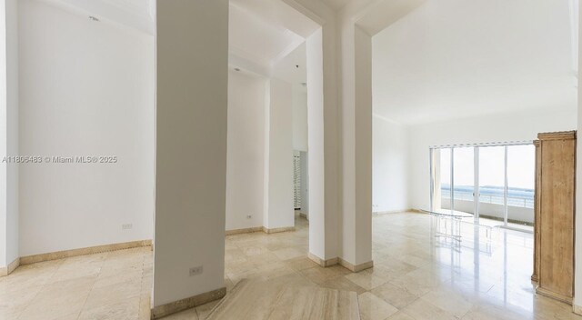 808 Brickell Key Dr Unit 404, Miami, FL 33131 - spare room with baseboards and light tile patterned floors