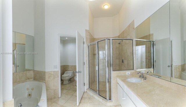 808 Brickell Key Dr Unit 404, Miami, FL 33131 - full bathroom with toilet, a tub with jets, a stall shower, and vanity