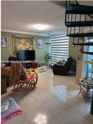 2110 SW 122nd Ct Unit 2110, Miami, FL 33175 - tiled living area featuring ornamental molding