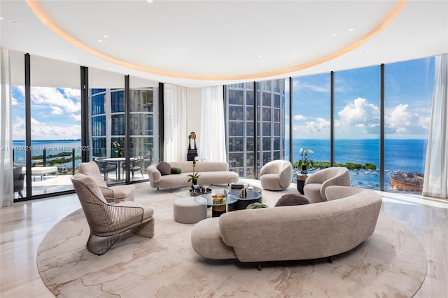 2821 S Bayshore Dr Unit 20Ab, Miami, FL 33133 - living area featuring a wall of windows, a water view, and plenty of natural light