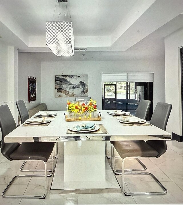 8992 Palm Tree Ln Unit 8992, Pembroke Pines, FL 33024 - dining space with a tray ceiling