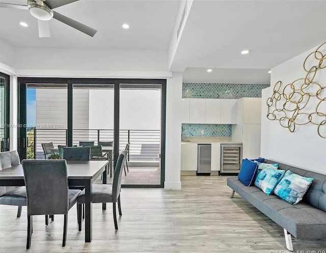 332 Balboa St, Hollywood, FL 33019 - dining room with wine cooler, ceiling fan, light wood-style floors, and recessed lighting