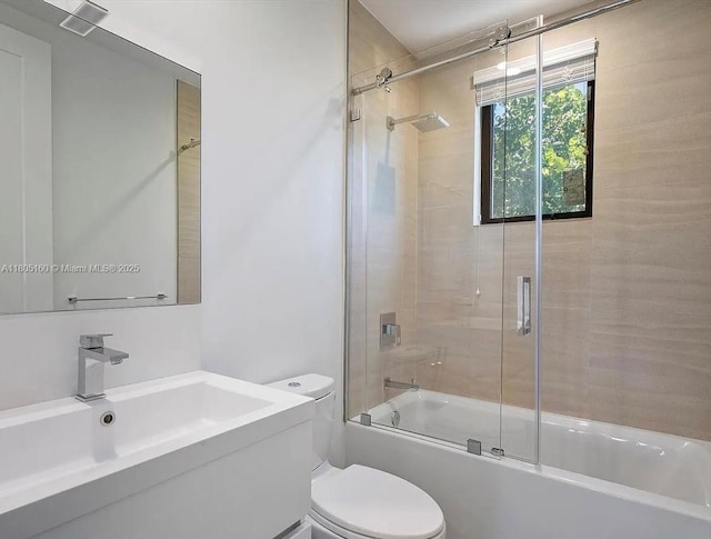 332 Balboa St, Hollywood, FL 33019 - full bathroom with toilet, bath / shower combo with glass door, and vanity