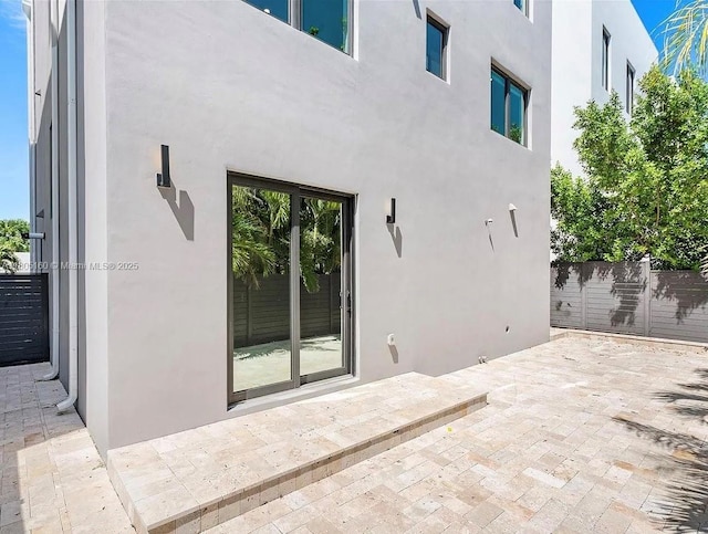 332 Balboa St, Hollywood, FL 33019 - back of property with a patio and stucco siding