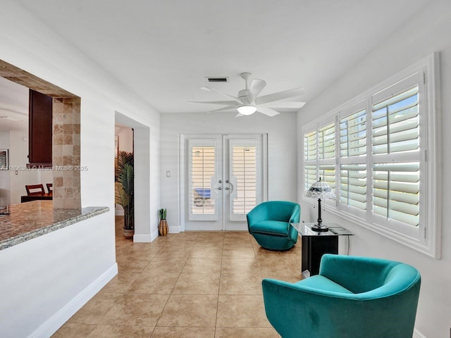 3401 NE 21st Ave, Lighthouse Point, FL 33064 - sitting room with french doors, a ceiling fan, baseboards, and light tile patterned floors