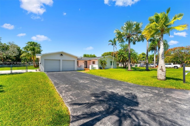 8885 SW 182nd Ter, Palmetto Bay, FL 33157 - ranch-style home featuring an attached garage, stucco siding, and driveway