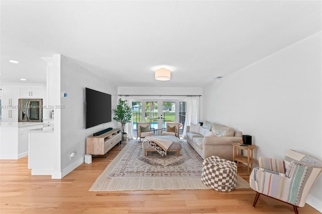8885 SW 182nd Ter, Palmetto Bay, FL 33157 - living room with light wood-style flooring and recessed lighting